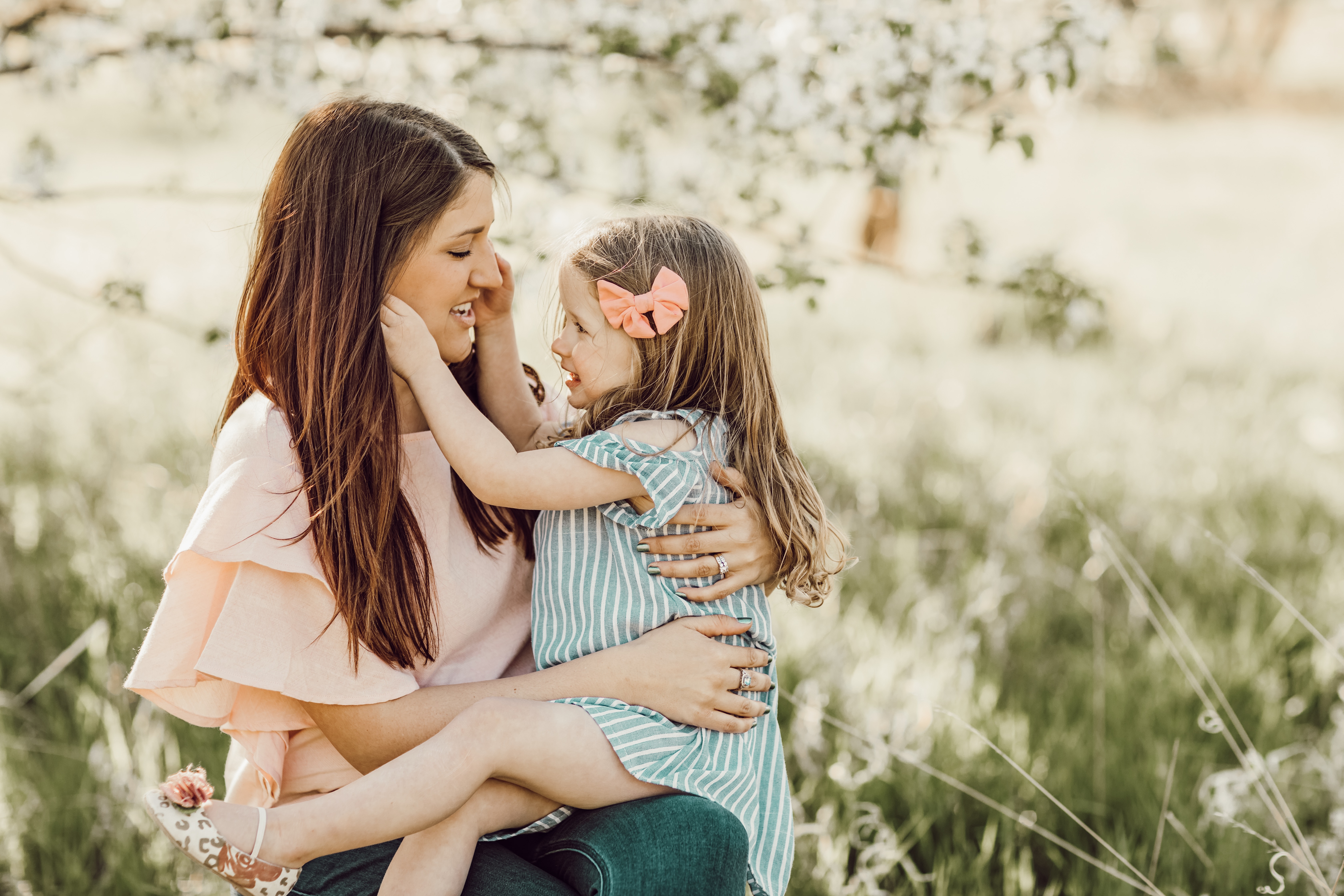 Mother and daughter embrace change and share love in springtime 