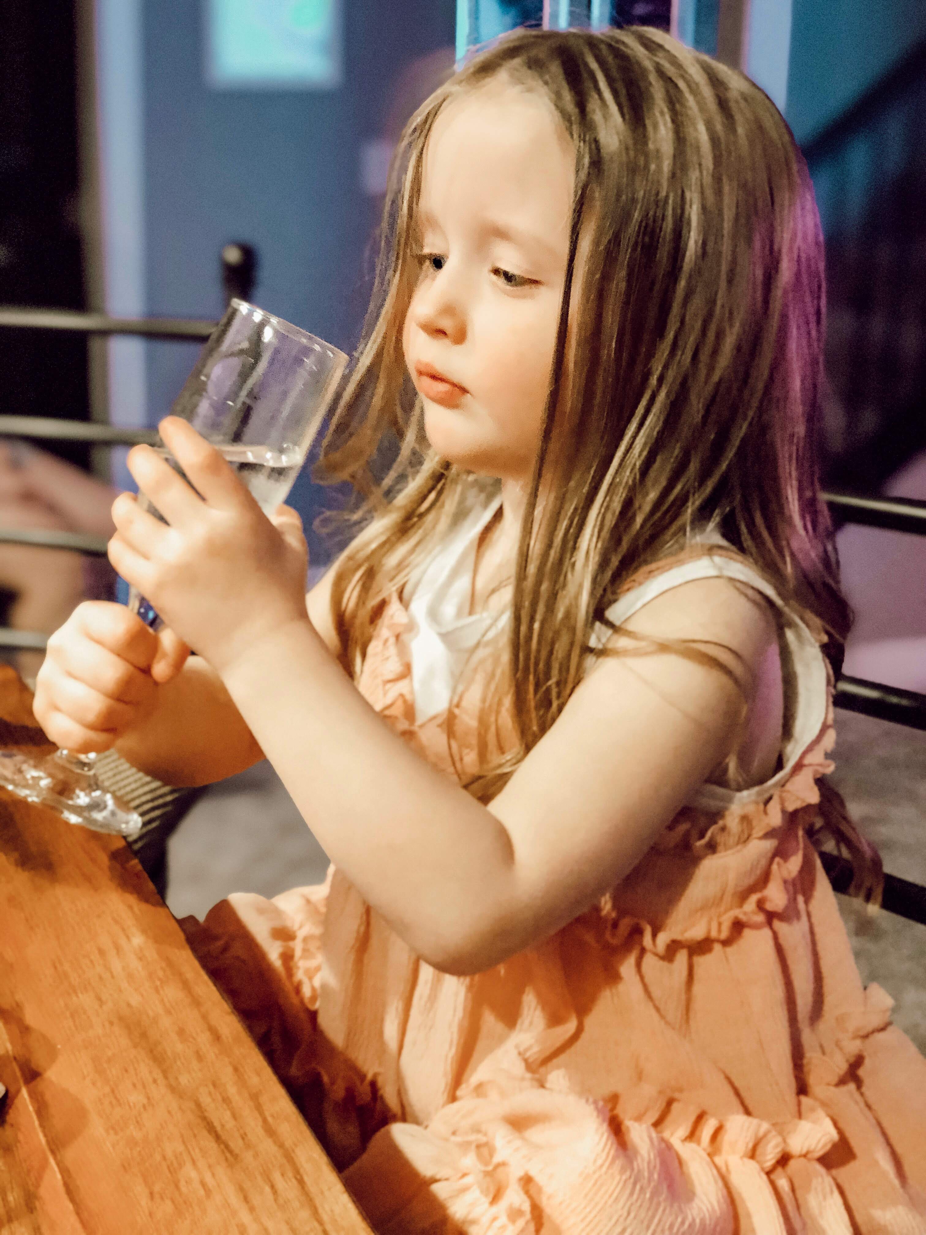 Child drinking water to eliminate toxins