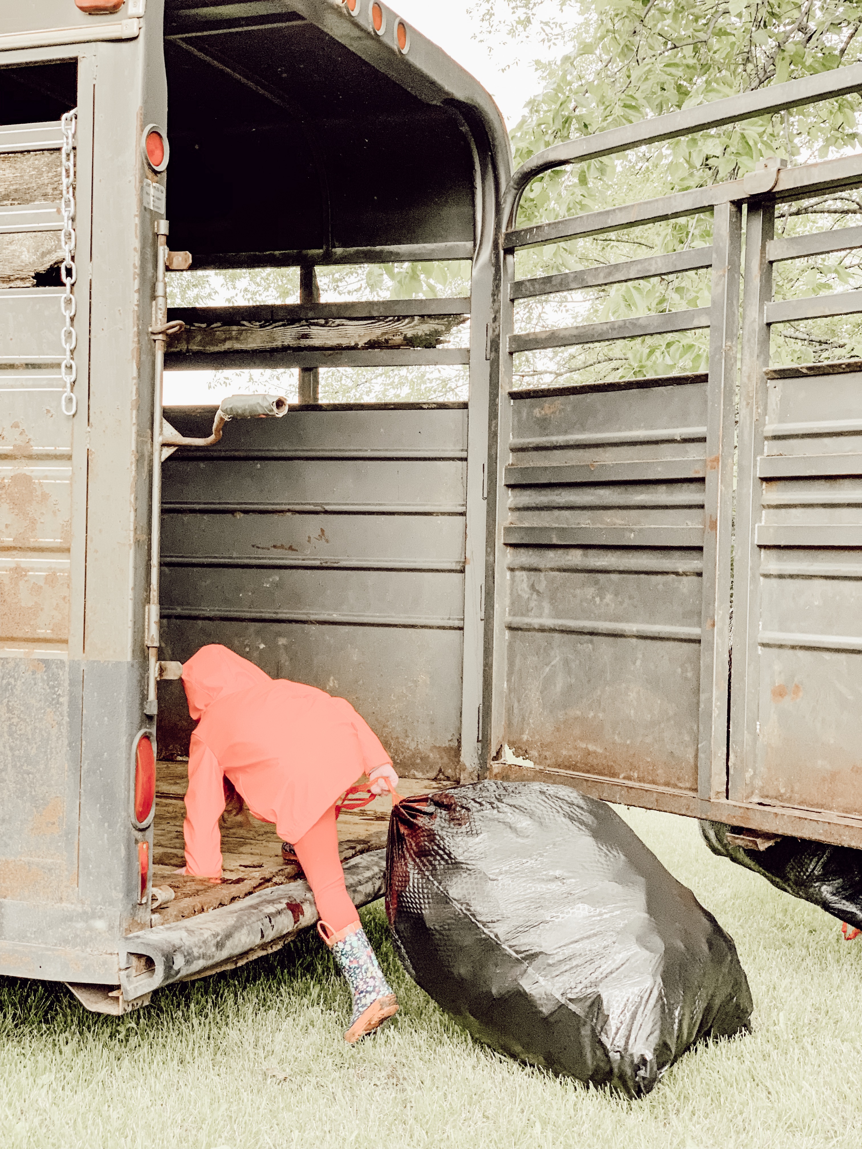 Farm girl working for commission recycling cans